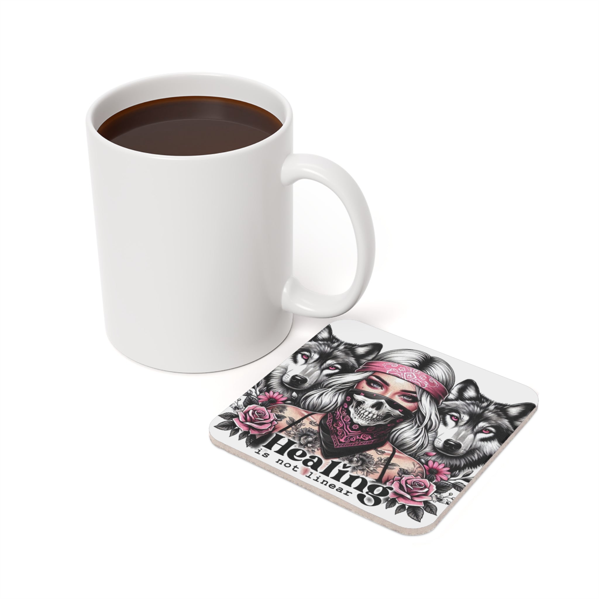 White mug and square coaster with a bandana-clad woman and wolves illustration.