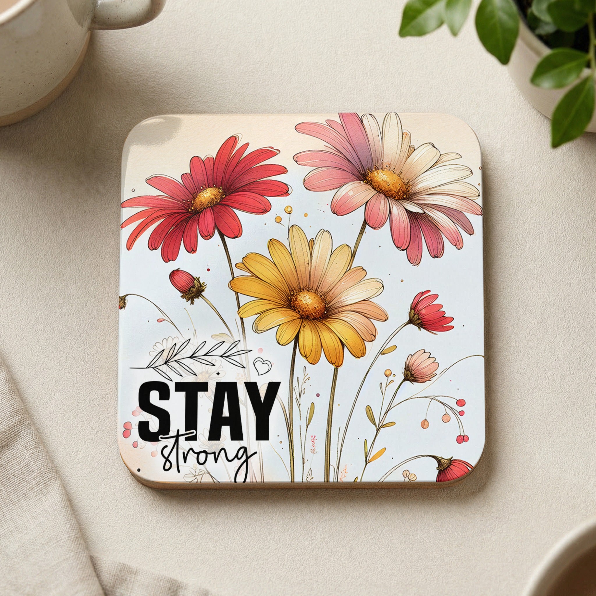 Coaster with pink and yellow daisies and "STAY STRONG" text.