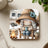 Coaster featuring a cartoon camper, campfire, and person in a hat holding a mug.