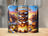 Official S'mores Tester tumbler with campfire, marshmallows, graham crackers, and chocolate.