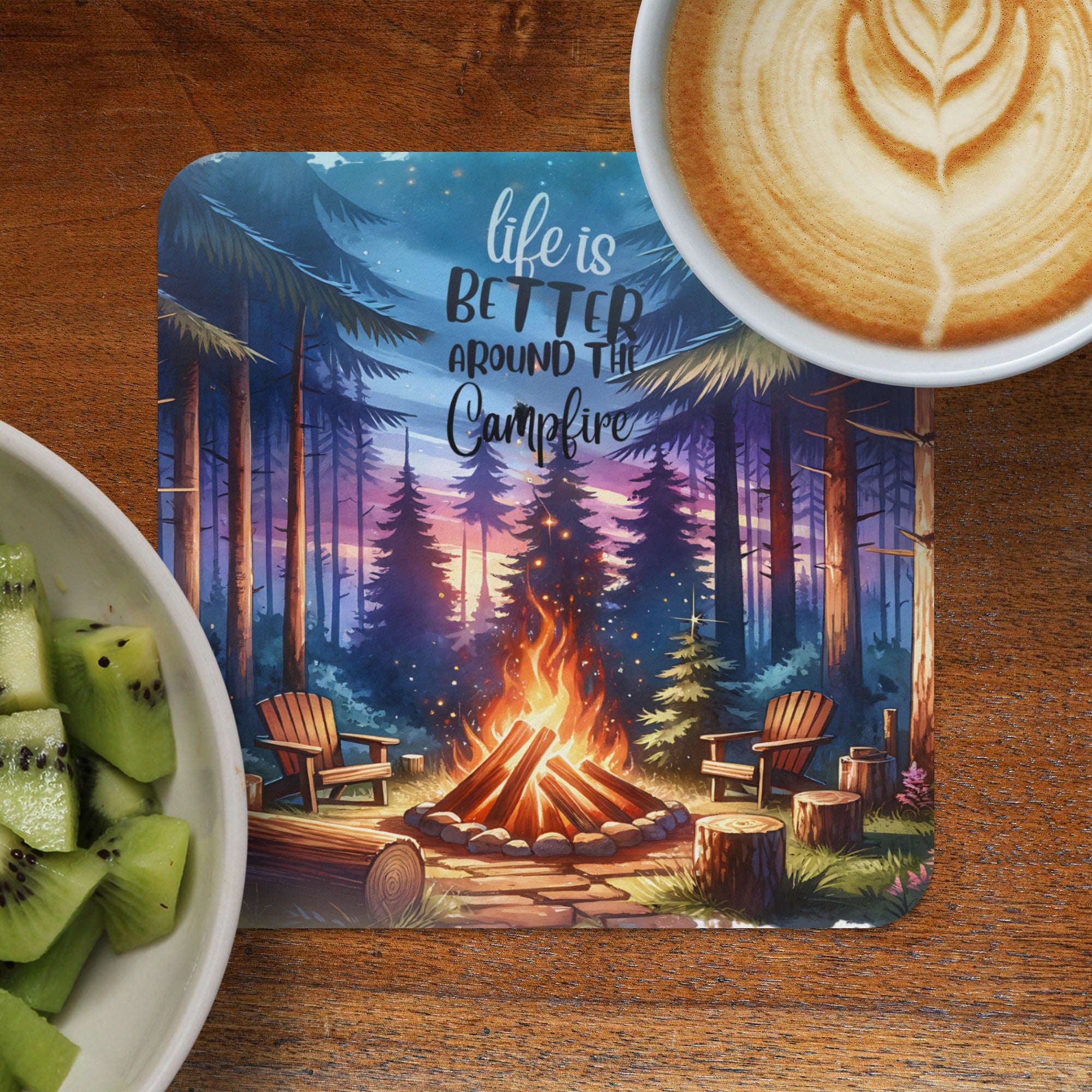 Campfire scene with inspirational text and latte art beside a bowl of kiwi.