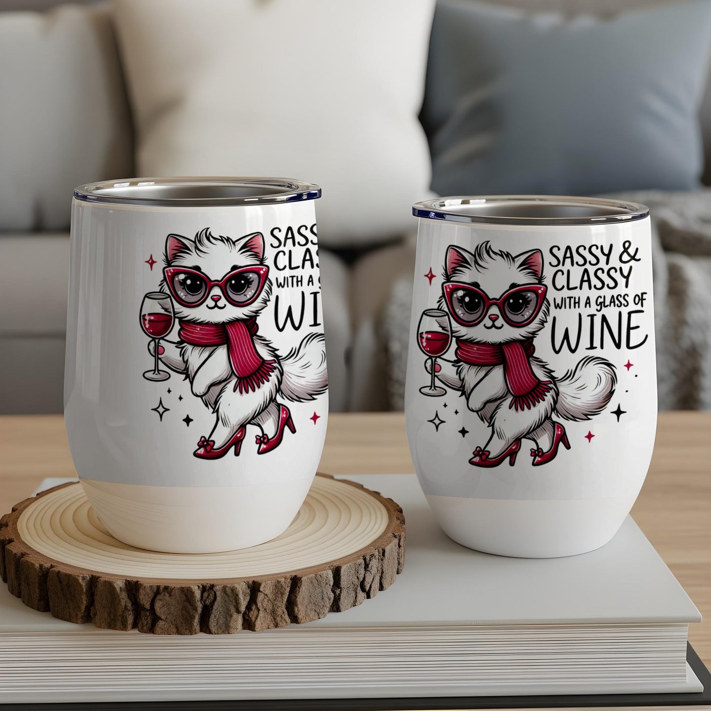 Two white wine tumblers featuring a sassy cat with a glass of wine.