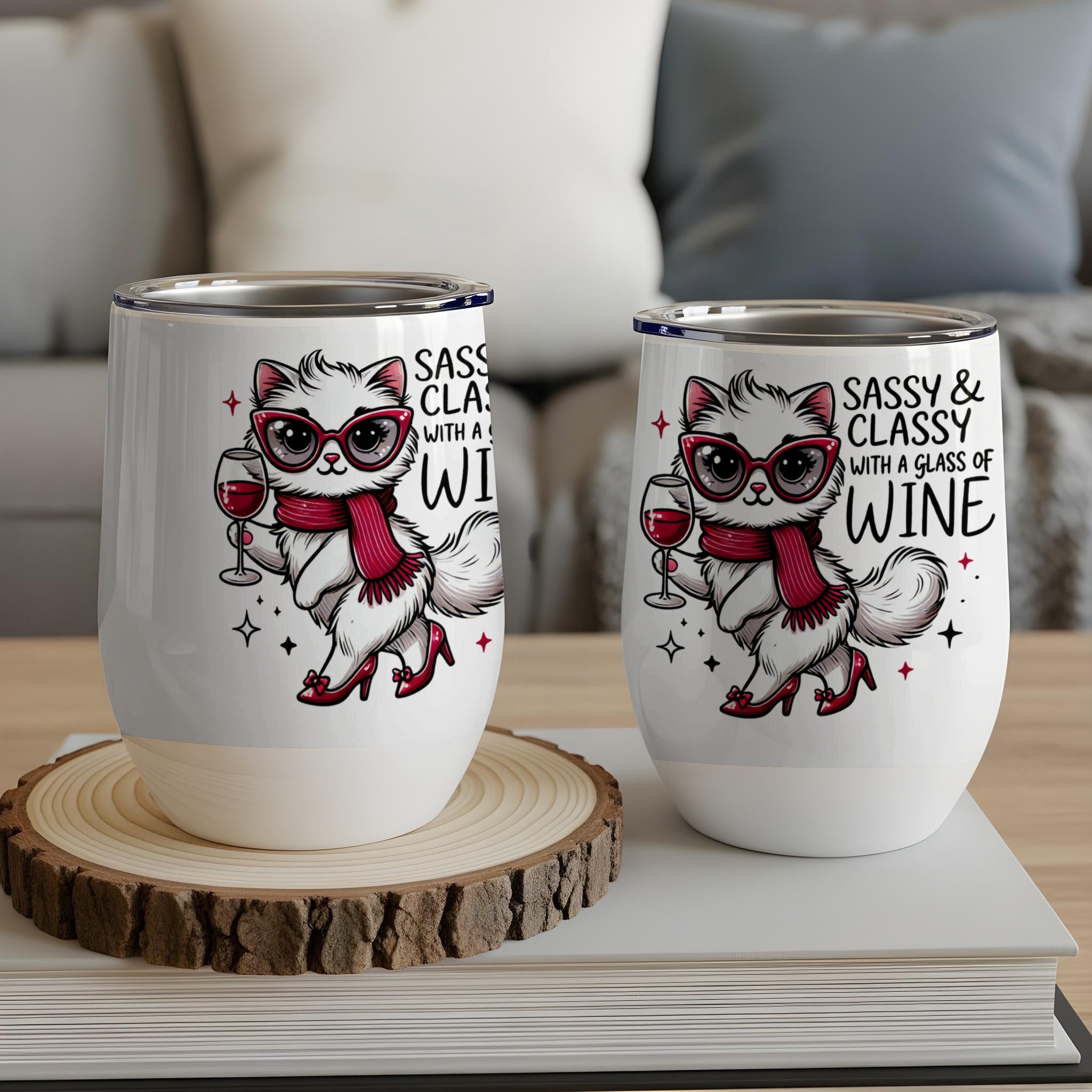 Two white wine tumblers featuring a sassy cat with a glass of wine.