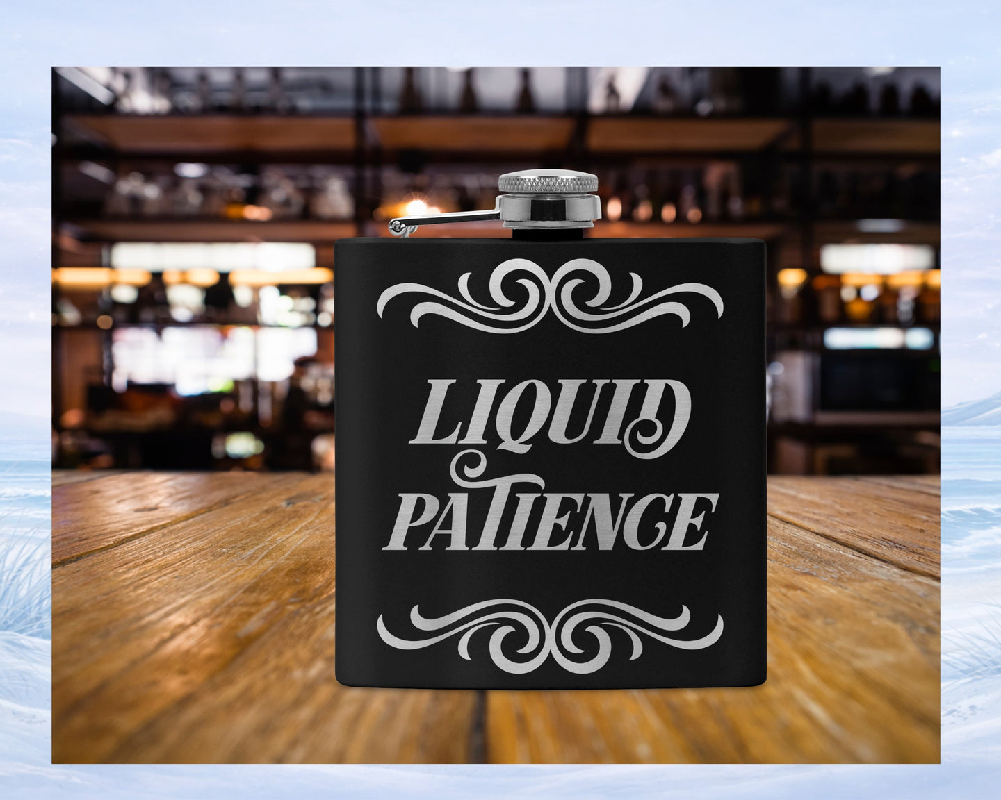 Black flask with "LIQUID PATIENCE" in ornate white text on wooden surface.