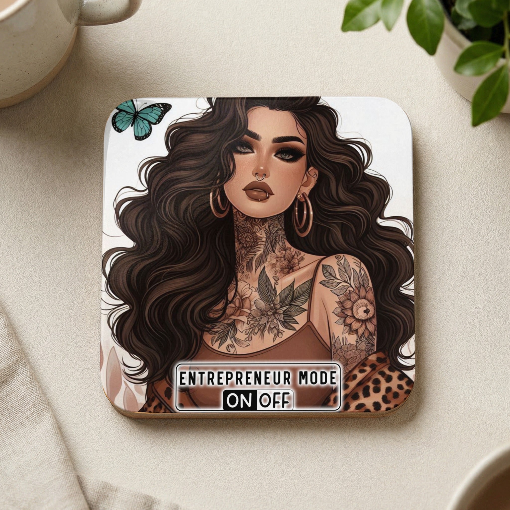 Tattooed woman with flowing hair, "Entrepreneur Mode On" text, on a coaster.