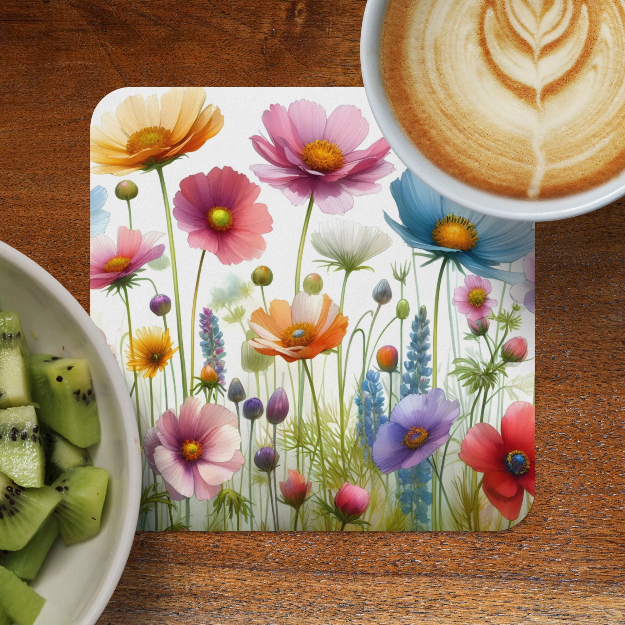 Floral print coaster with coffee and kiwi slices.