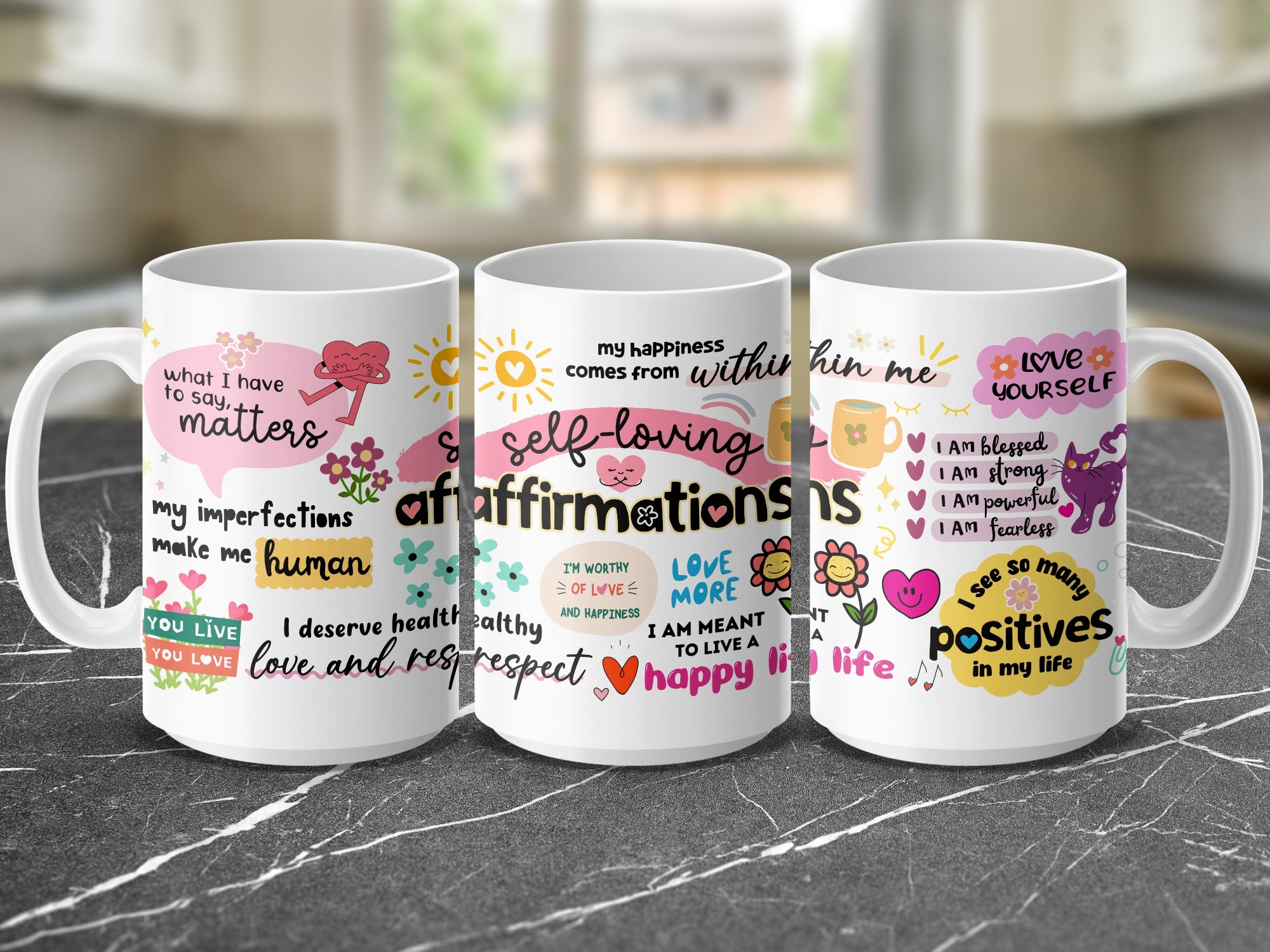Three mugs with inspirational quotes about self-love and happiness.