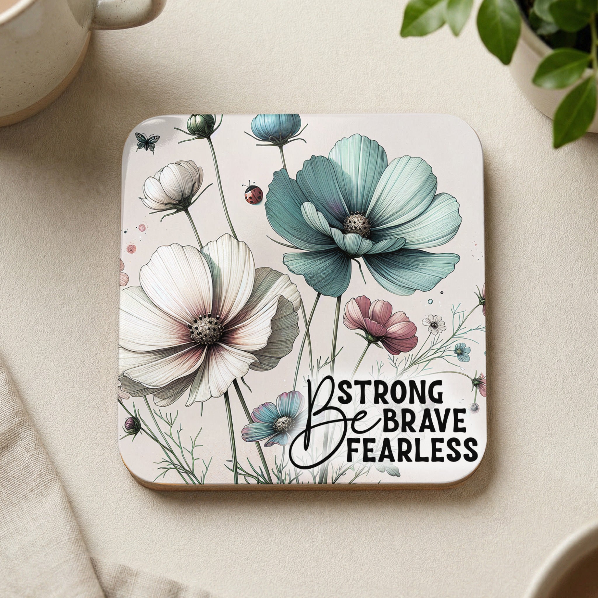Coaster with delicate floral illustration and "Strong Brave Fearless" text.