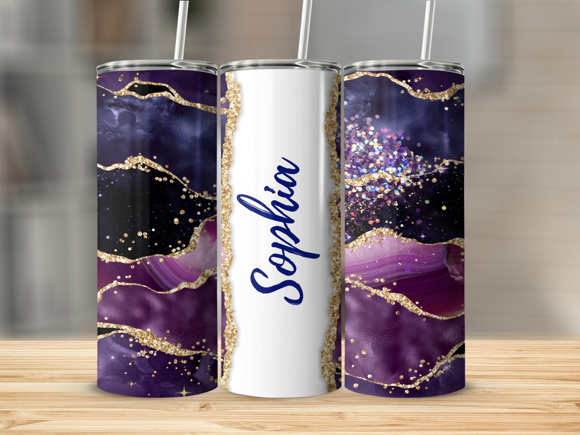 Purple and gold agate design tumbler with "Sophia" in blue script.