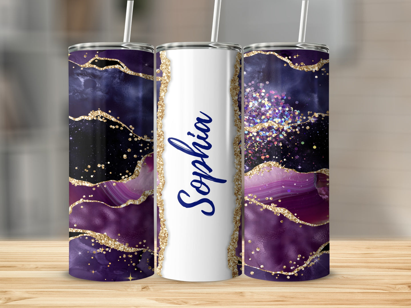 Purple and gold agate design tumbler with "Sophia" in blue script.