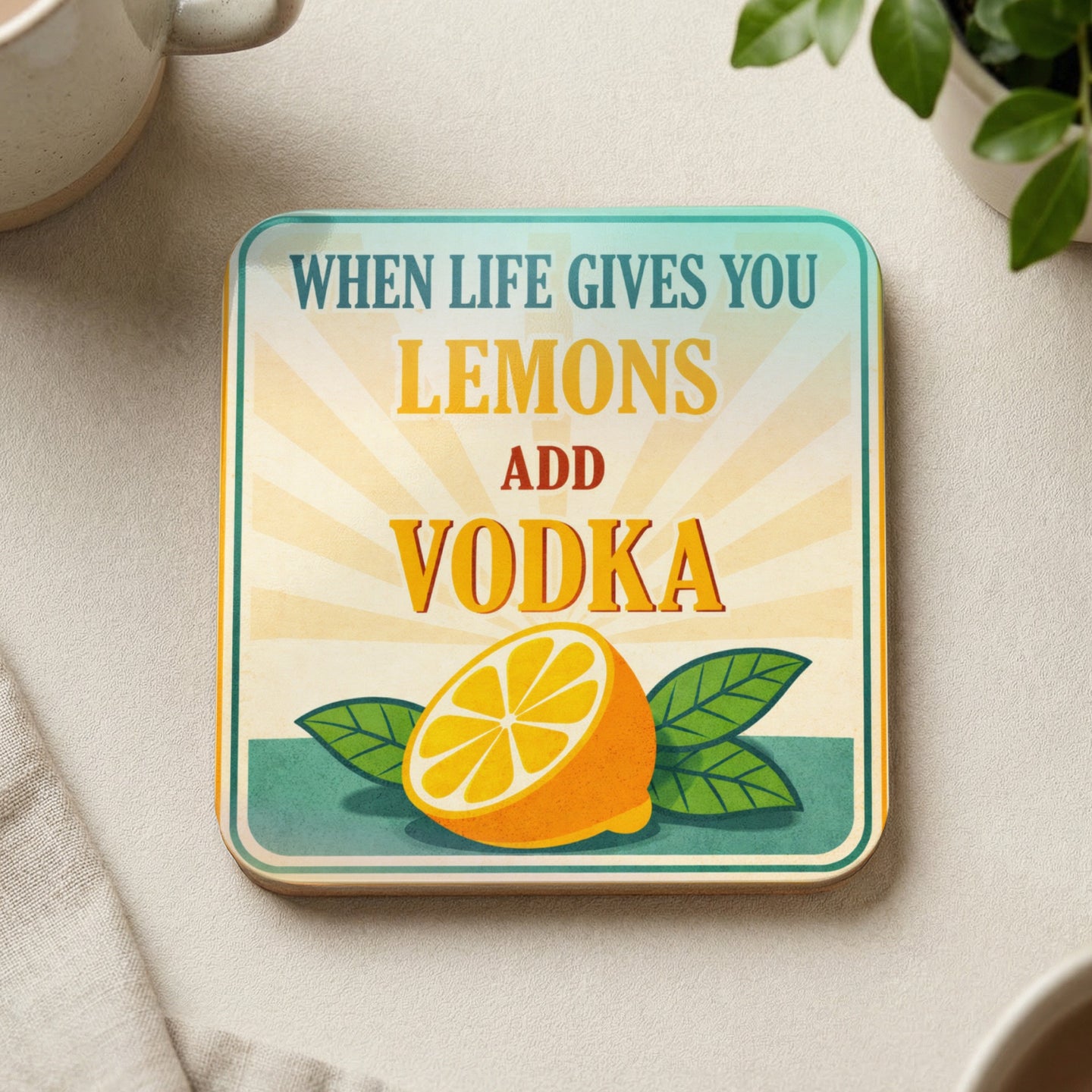 Coaster with lemons, leaves, and text "When life gives you lemons add vodka".