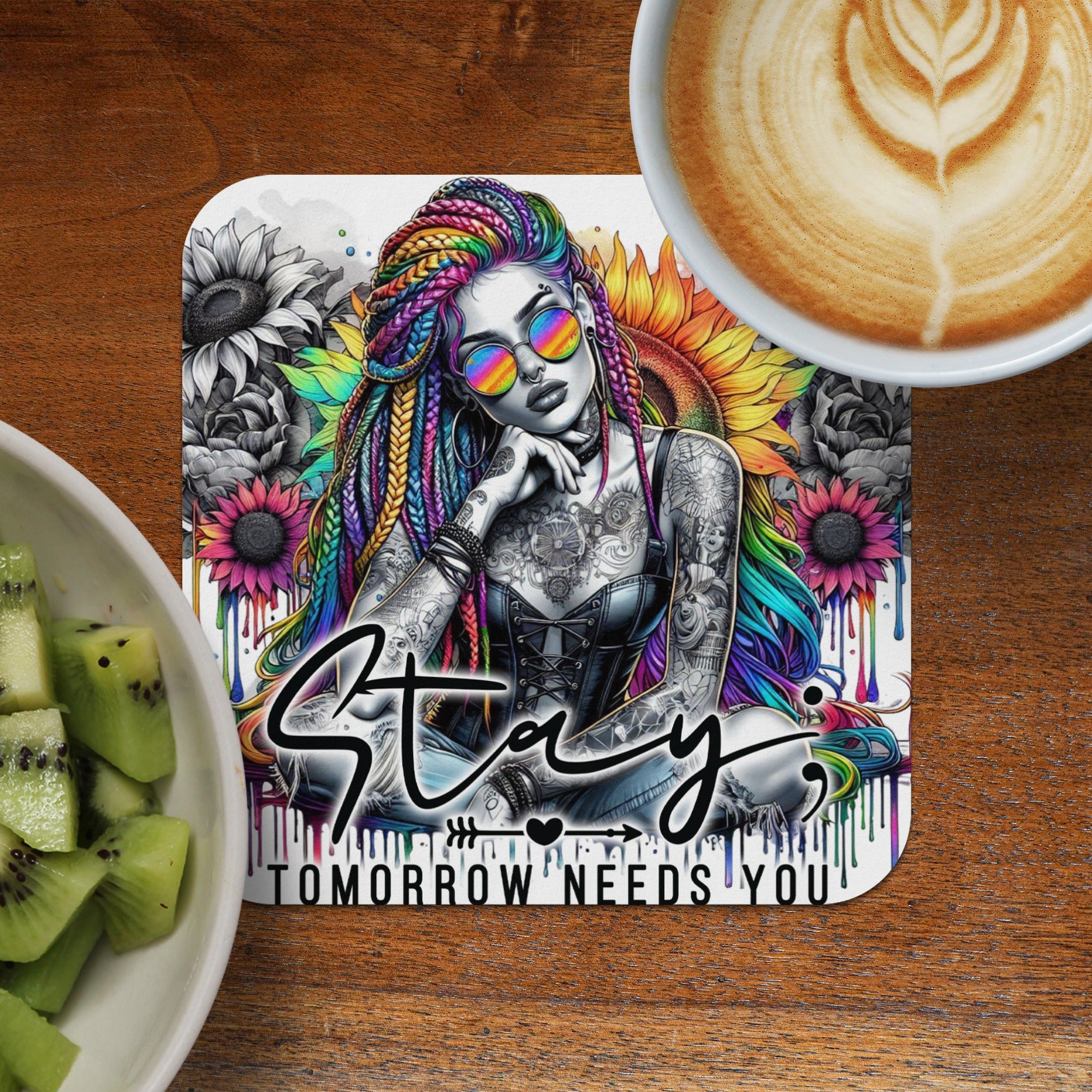 Woman with colorful braids and tattoos sits with a floral background and text "Stay Tomorrow Needs You".