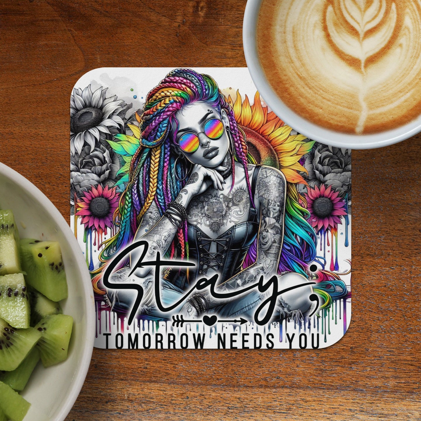 Woman with colorful braids and tattoos sits with a floral background and text "Stay Tomorrow Needs You".