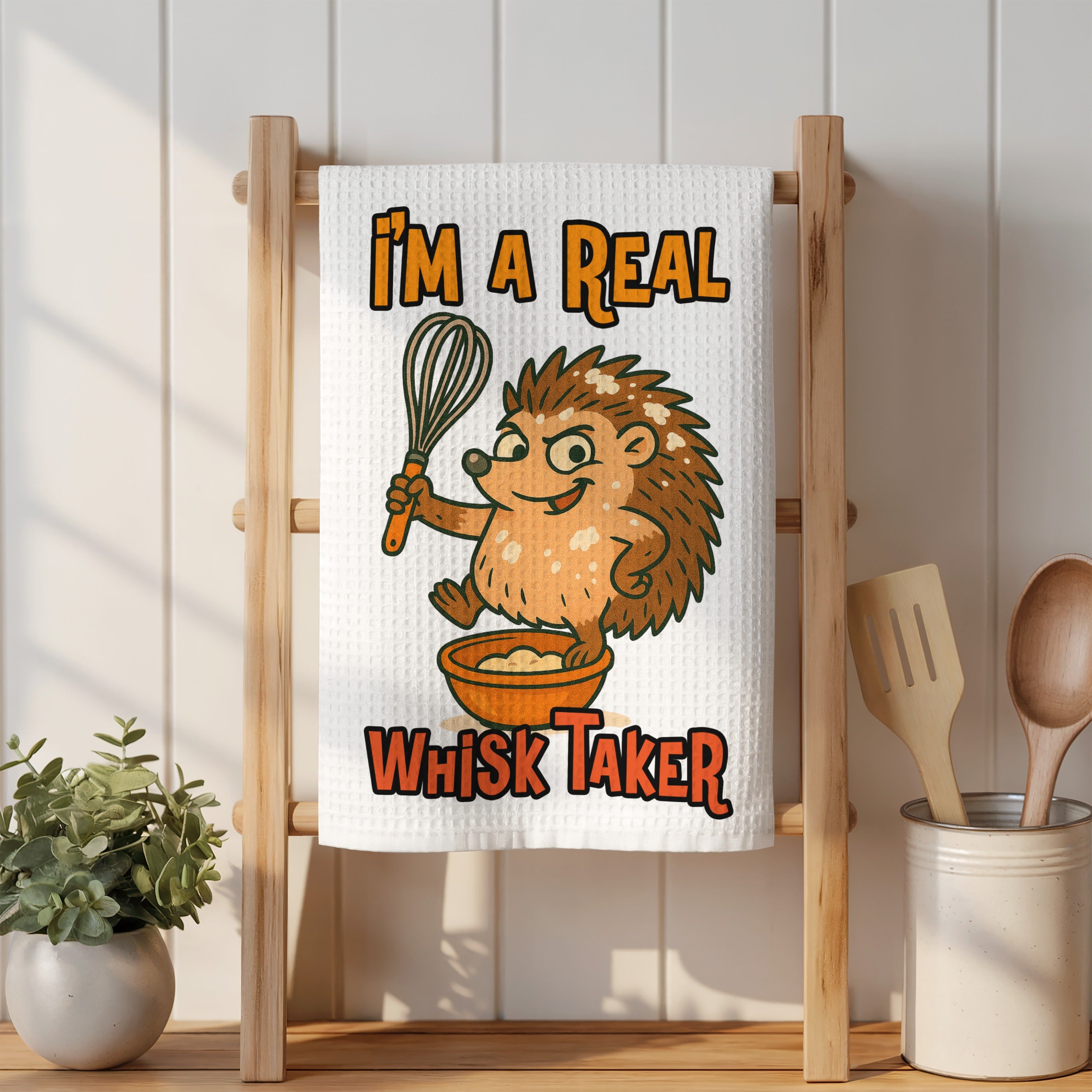 Hedgehog character holding a whisk over a bowl with text "I'M A REAL WHISK TAKER".