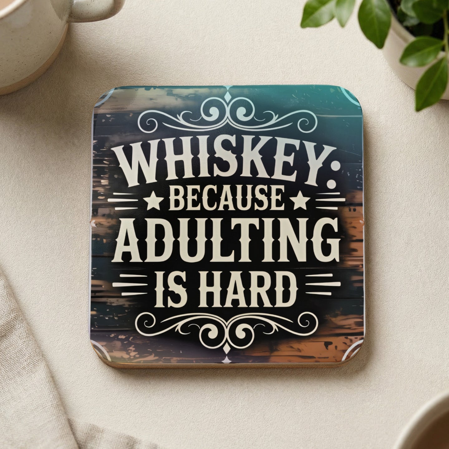 Coaster with "Whiskey because adulting is hard" text.