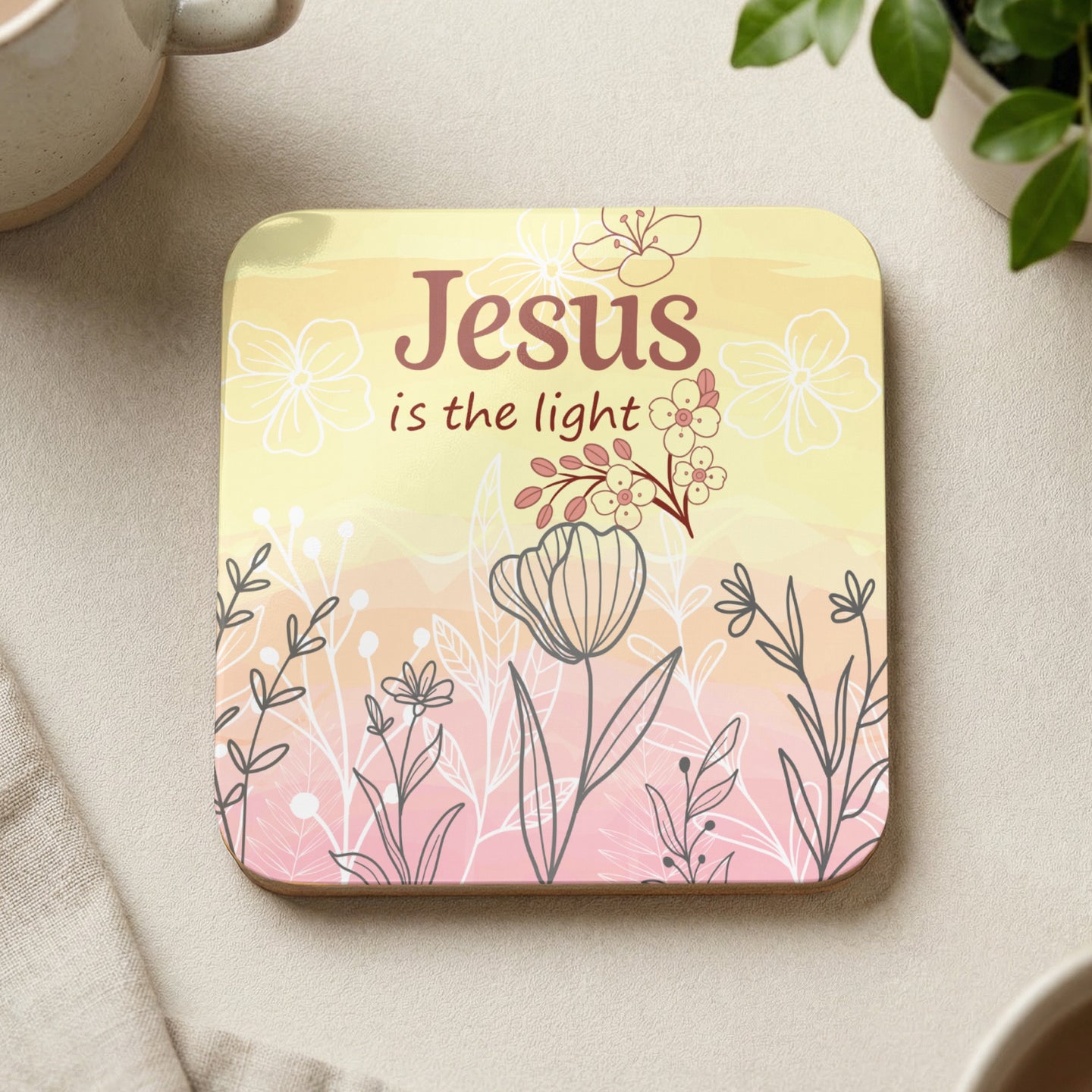 Square coaster with "Jesus is the light" text and floral illustration.