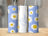 Personalized tumbler with white daisies on blue stripes and "Harper" text.