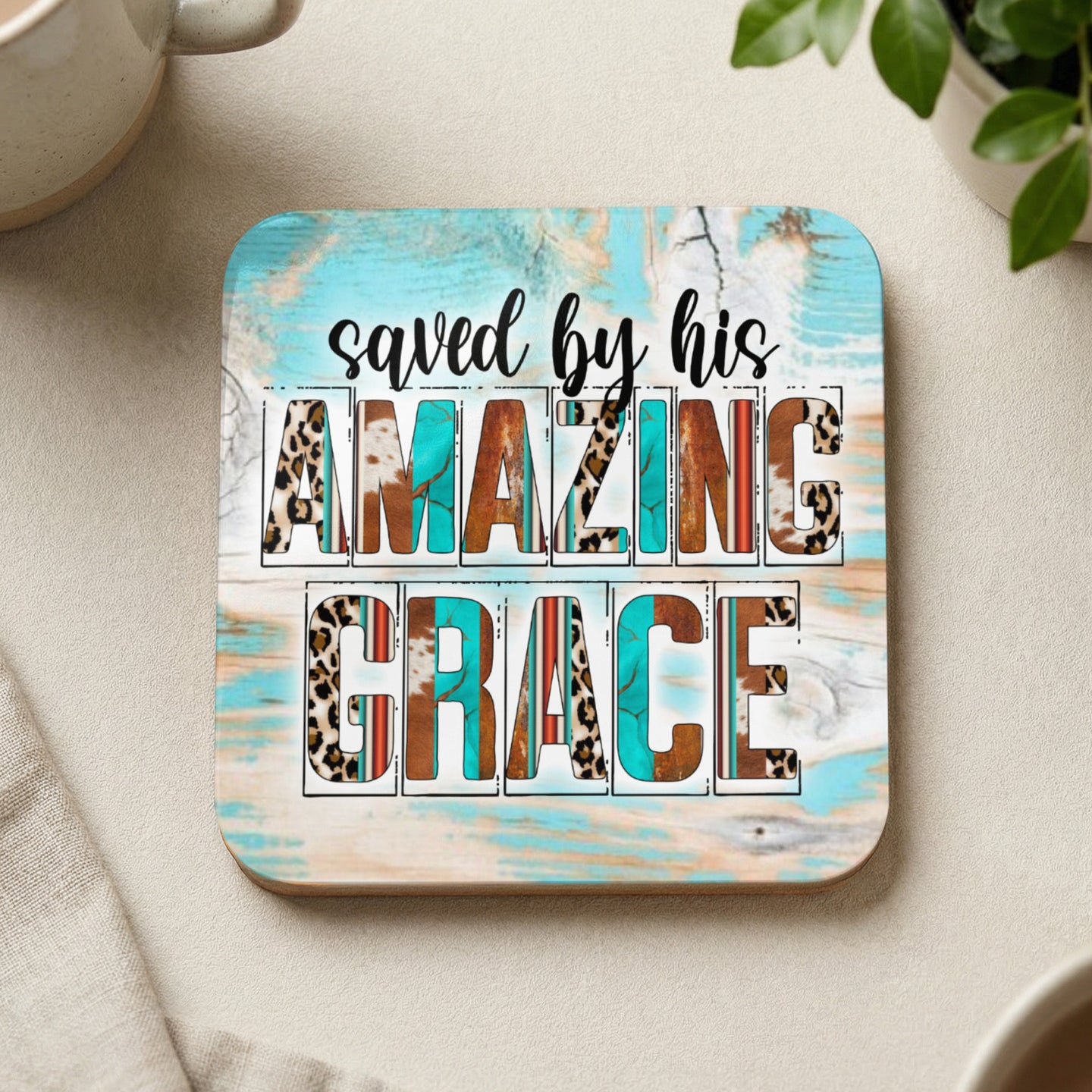 Coaster with "saved by his AMAZING GRACE" text and animal print accents.