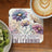 Floral coaster with "failing means I'M LEARNING" text, next to kiwi slices and coffee.