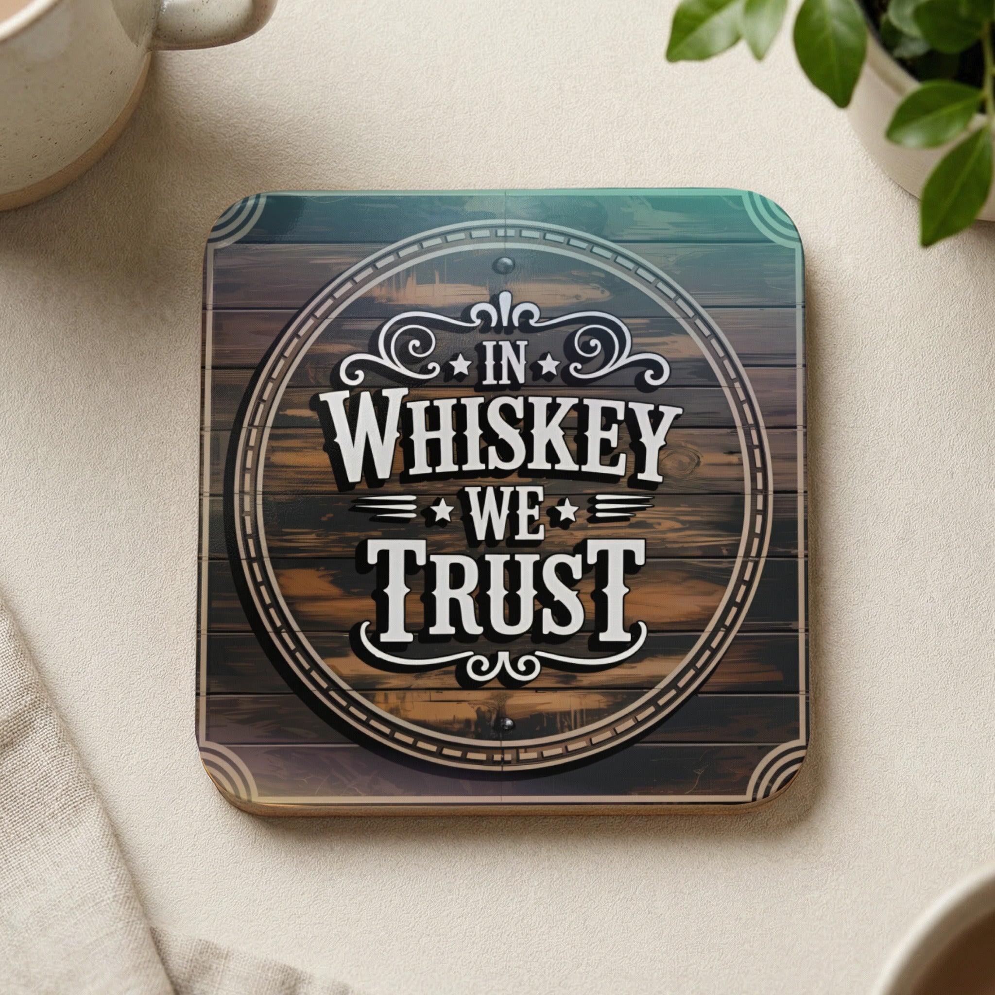 Wooden coaster with "In Whiskey We Trust" text in a circular design.