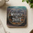 Wooden coaster with "In Whiskey We Trust" text in a circular design.