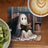 Ghost reading a book in a library with coffee and kiwi.