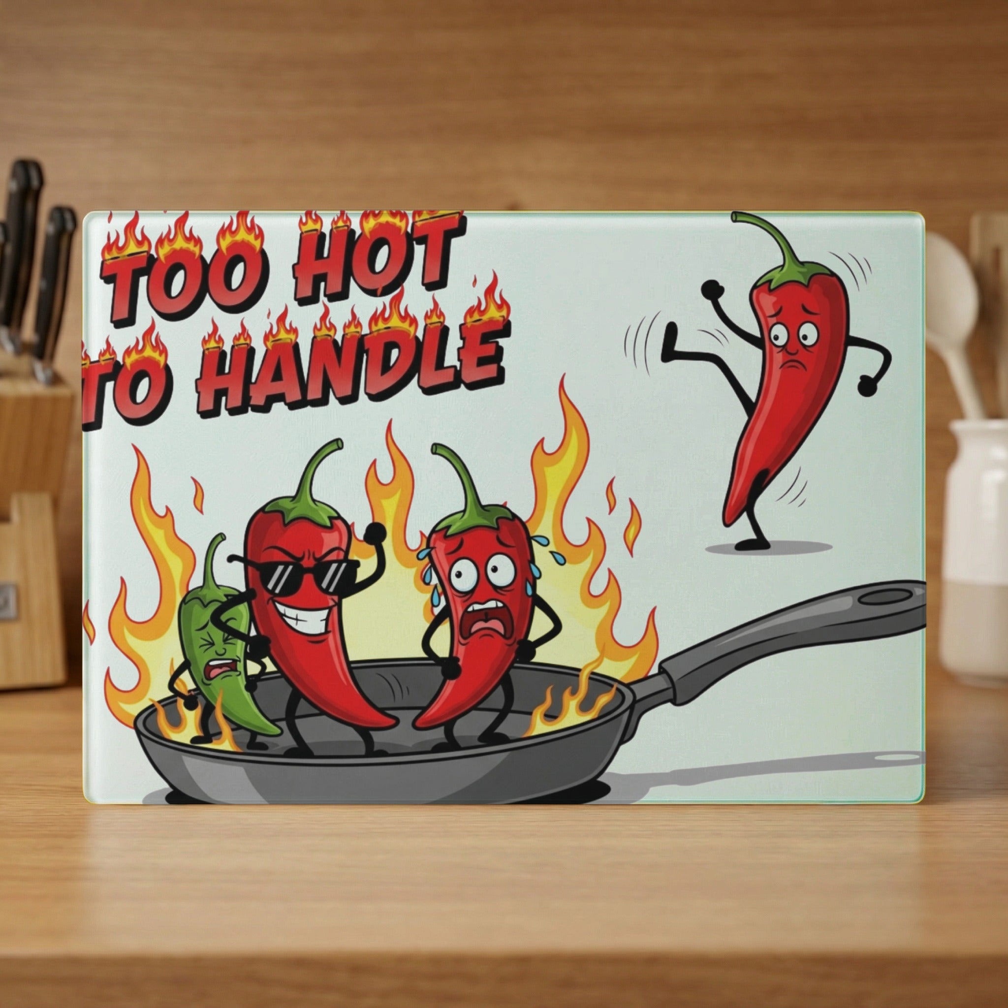 Too Hot to Handle cutting board with cartoon chili peppers in a frying pan.