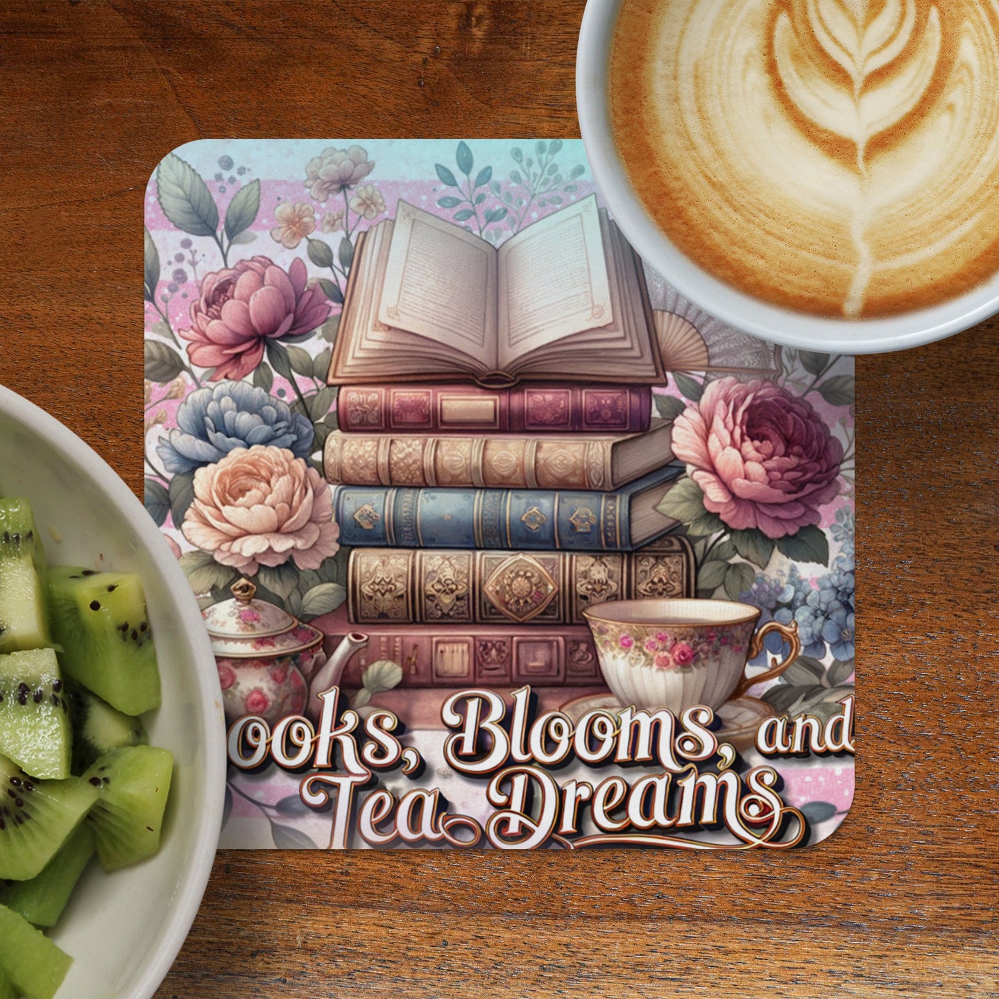 Stack of antique books with floral decorations and text "Books, Blooms, and Tea Dreams".