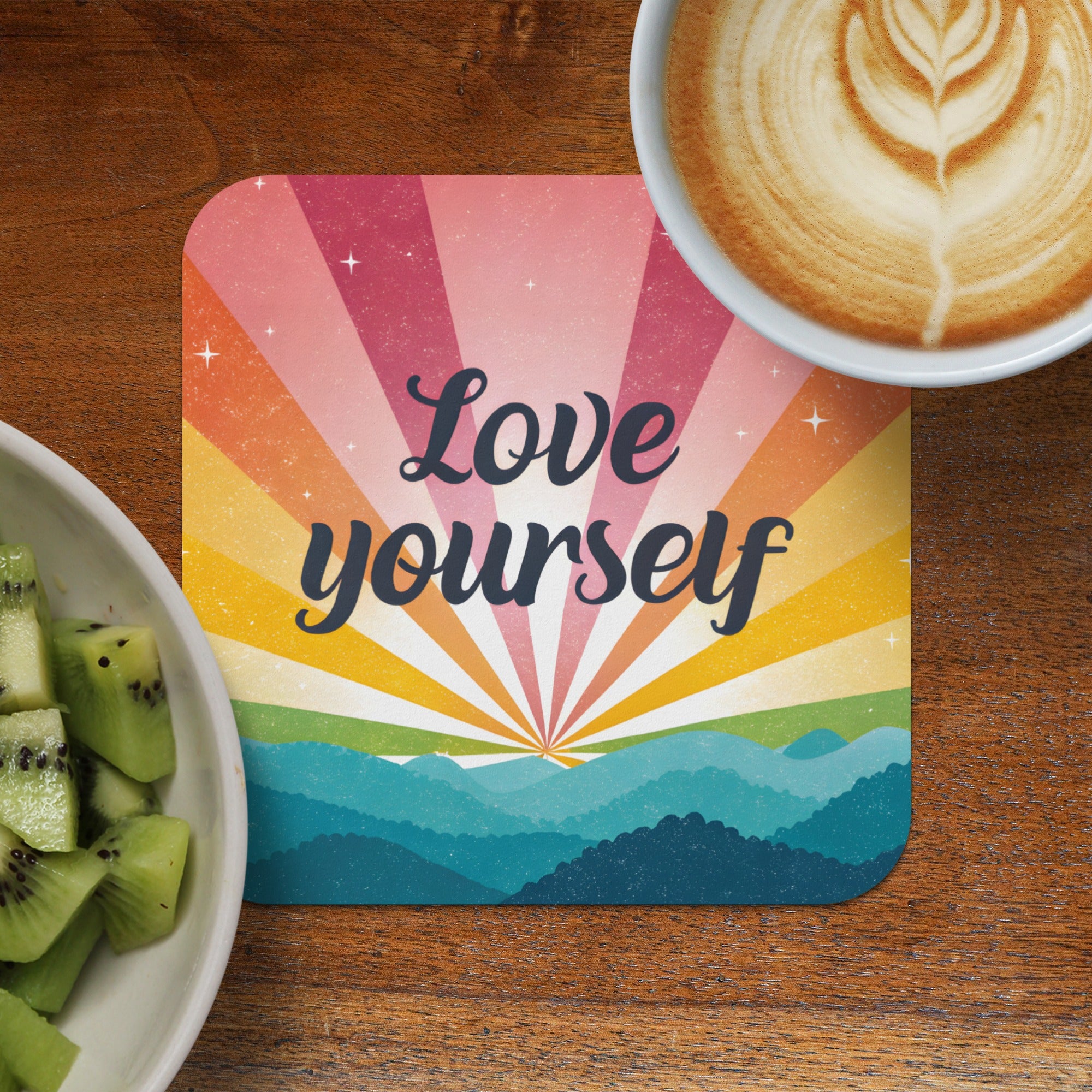 Coaster with "Love Yourself" text and colorful mountain sunrise graphic.