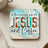 Square coaster with "Jesus and Coffee" text, teal and wood background.