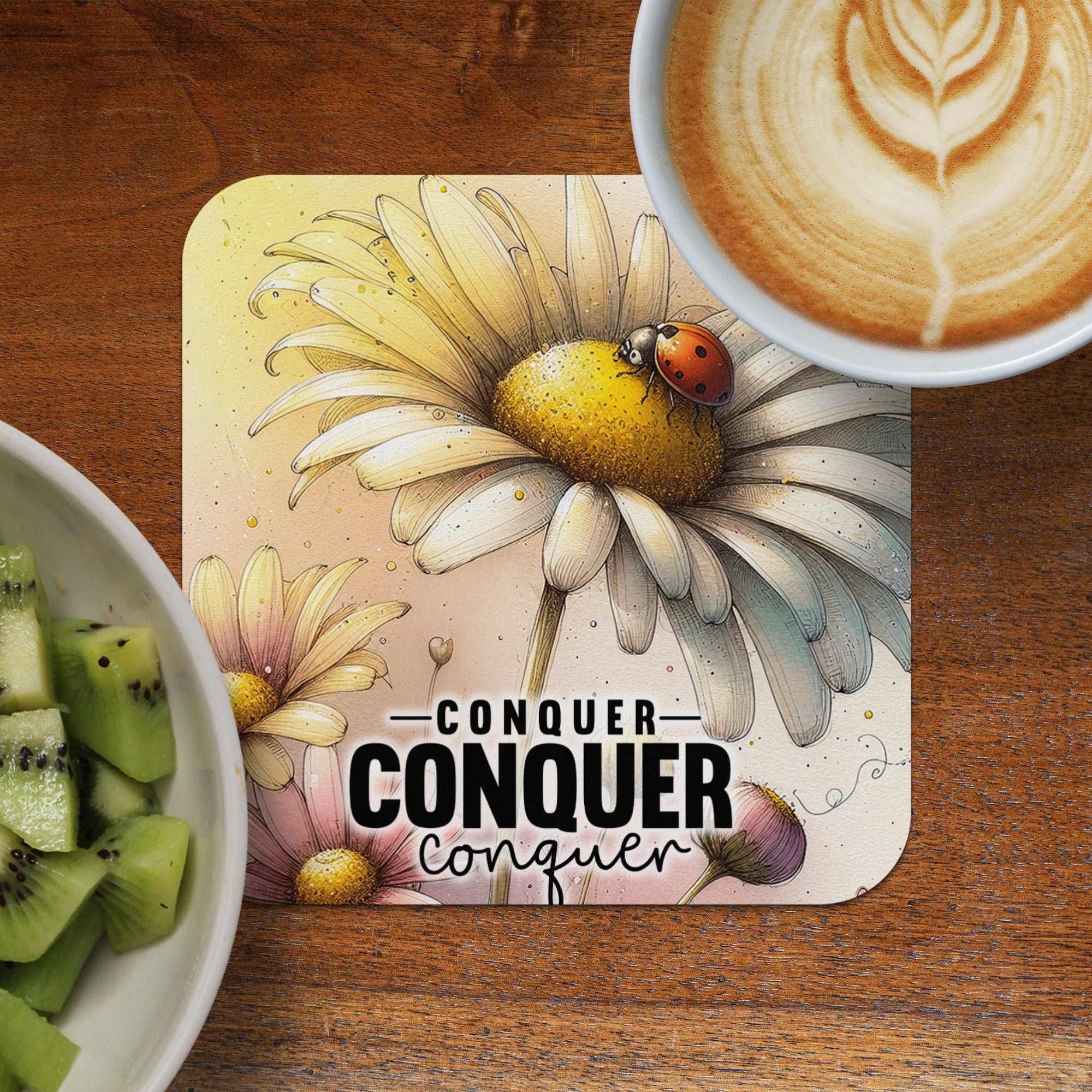 Coaster with daisy, ladybug, and motivational text "Conquer Conquer".