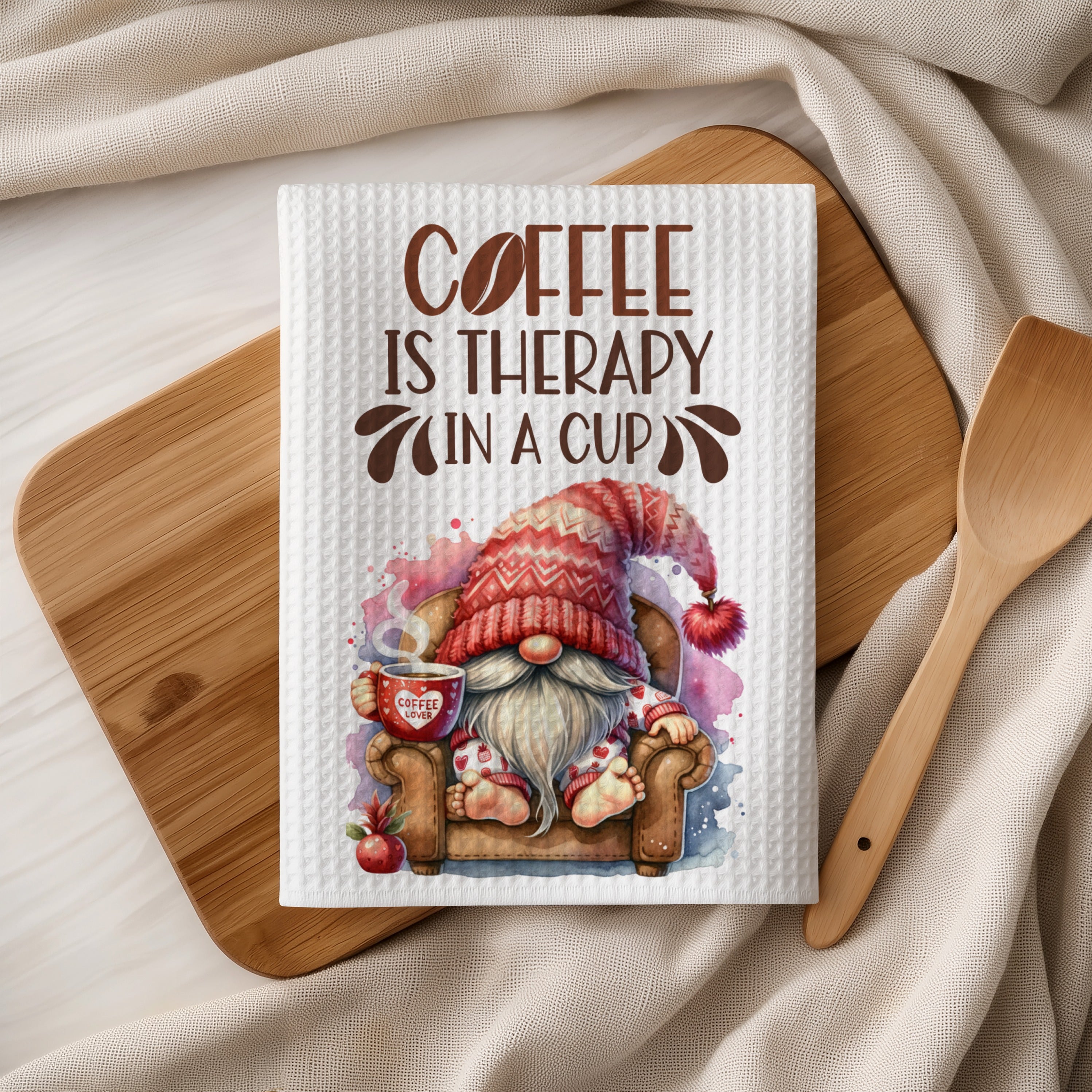Gnome with a coffee cup on a chair, text reads "Coffee is therapy in a cup".