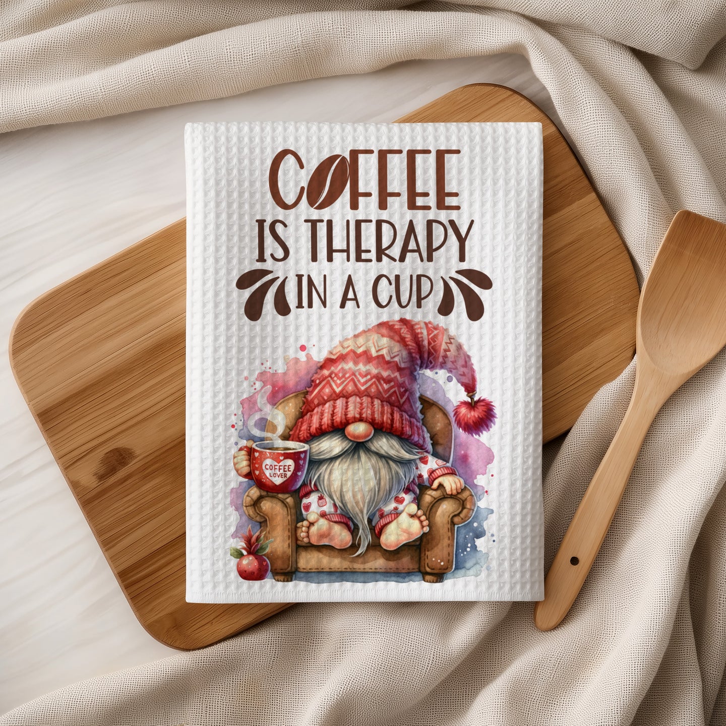 Gnome with a coffee cup on a chair, text reads "Coffee is therapy in a cup".
