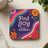 Coaster with "Find Joy In The Journey" text and colorful floral waves.