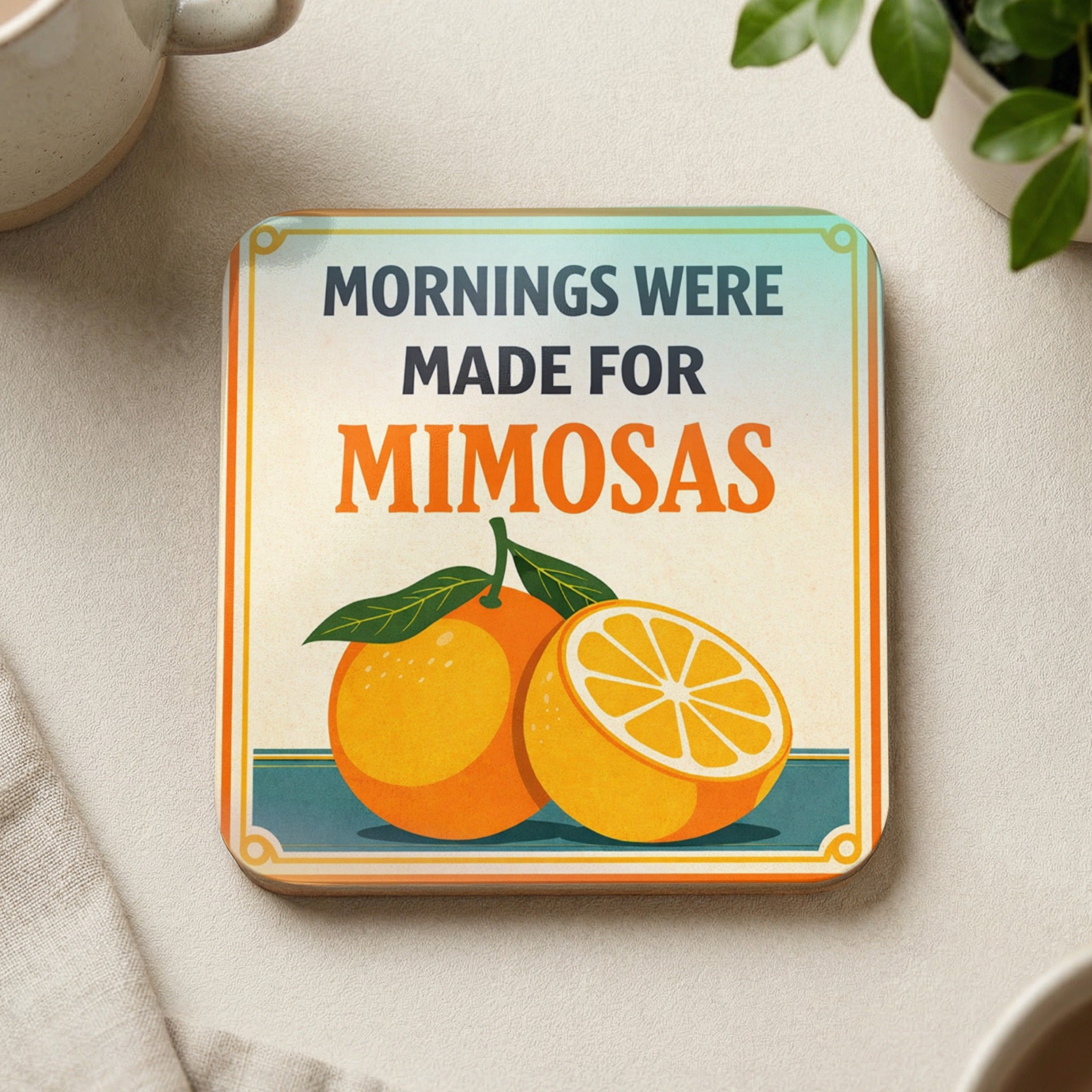 Coaster with "Mornings Were Made for Mimosas" text and orange illustration.