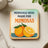 Coaster with "Mornings Were Made for Mimosas" text and orange illustration.