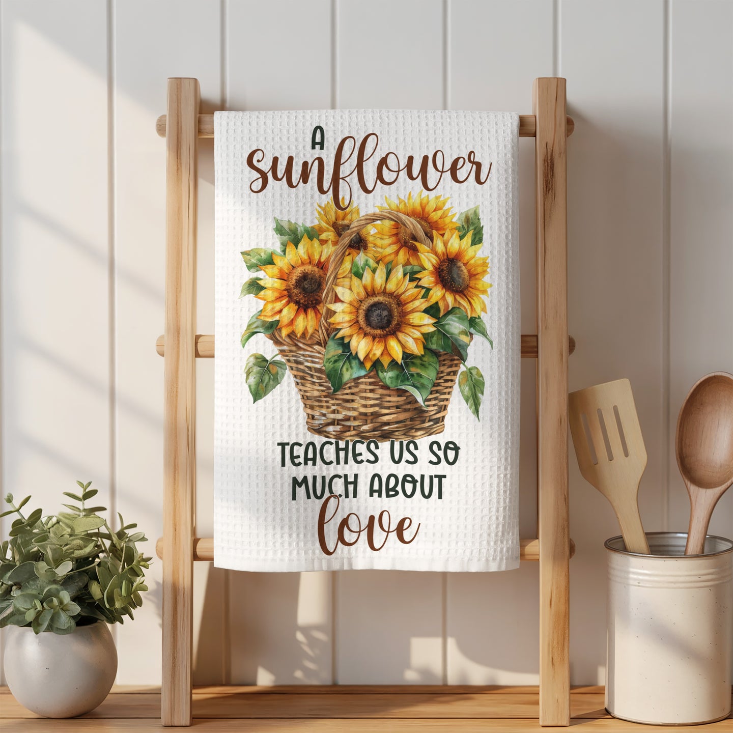 Waffle weave towel with sunflowers in a basket and text "A sunflower teaches us so much about love."