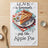 Towel with a slice of apple pie and text "LOVE is homemade just like Apple Pie".