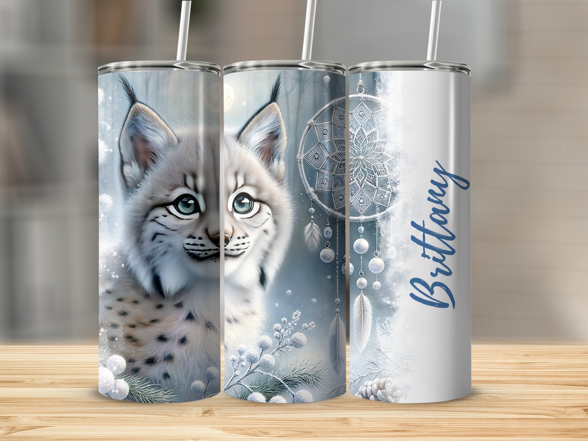 Lynx face with snowflakes and dreamcatcher on personalized Brittany tumbler.