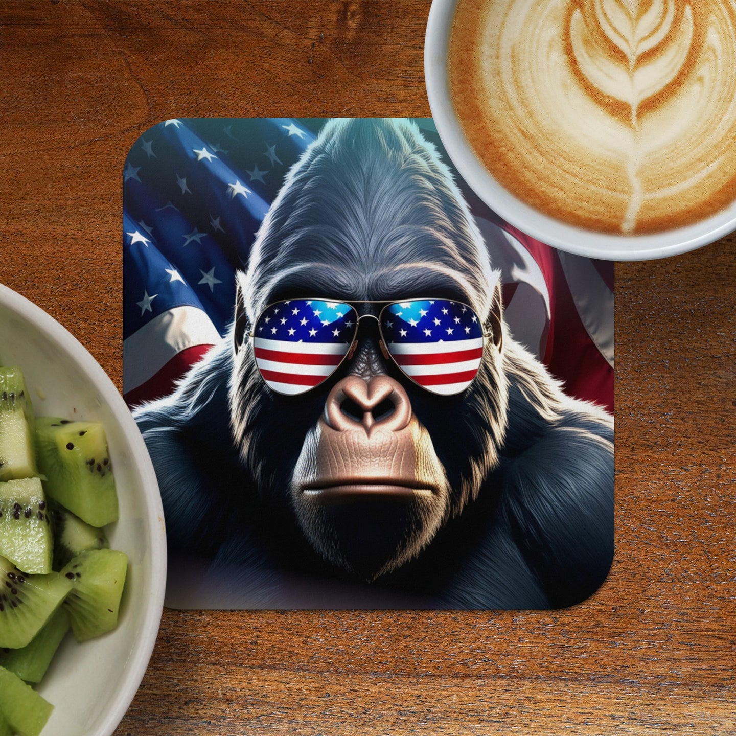 Gorilla wearing American flag sunglasses, front view, with coffee and kiwi.