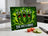 Green chopping board with three screaming pickles and the text "SHE HAS A KNIFE!".