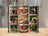 Tumbler with woodgrain background, featuring "DAD" in large letters and family photos.