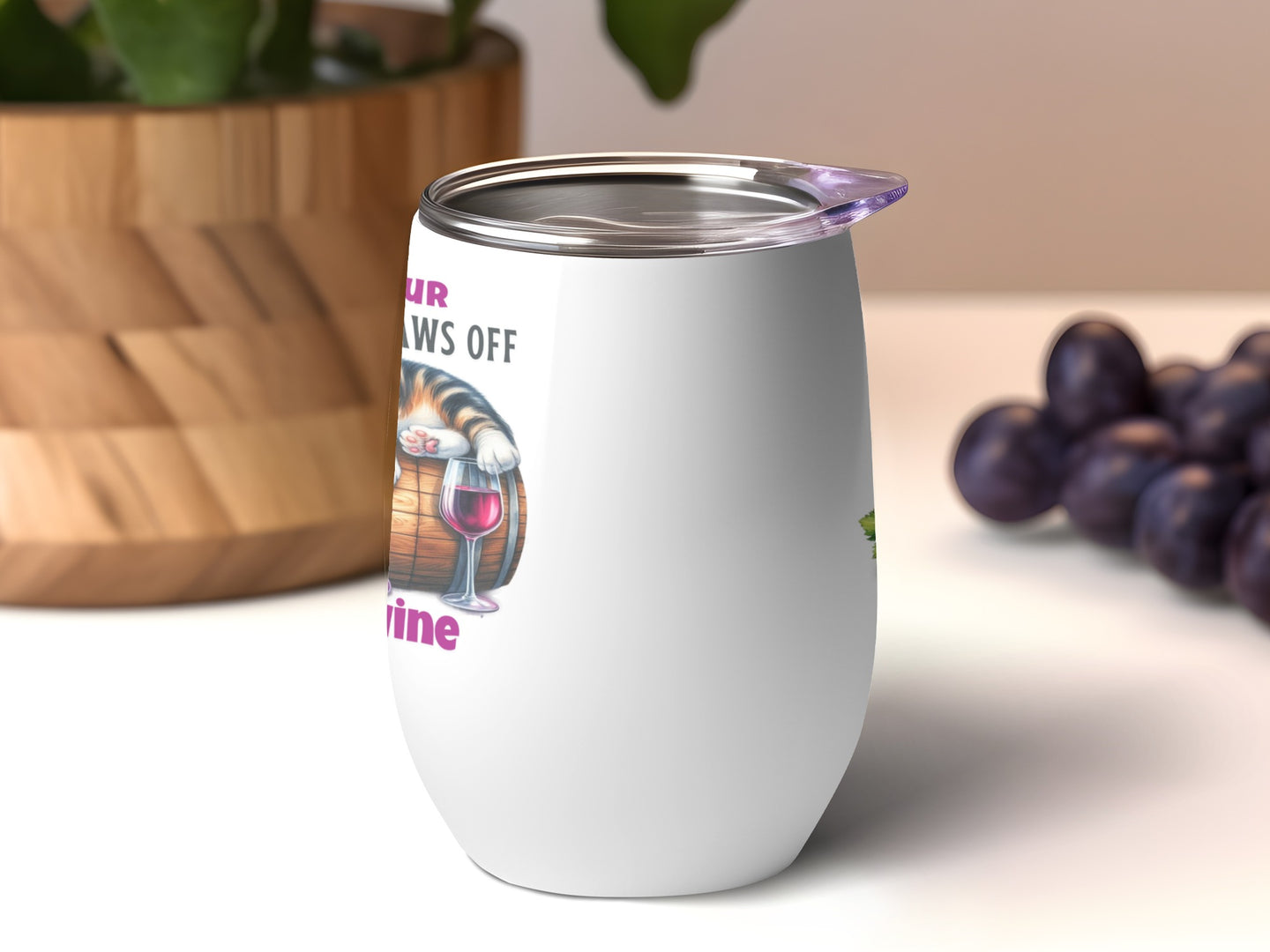 White insulated wine tumbler with a cat paw reaching for a glass of wine.