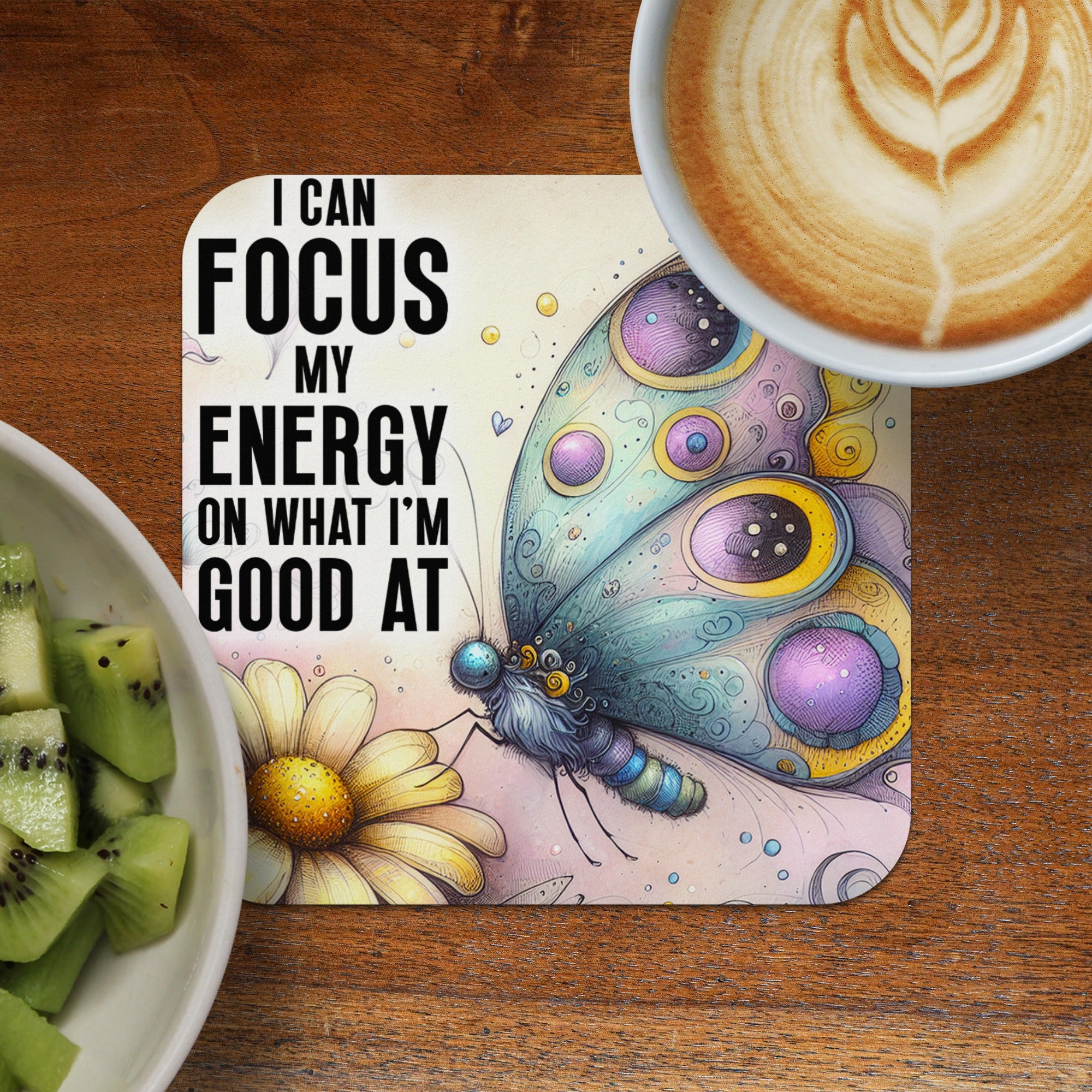 Butterfly and flower art on coaster with text "I CAN FOCUS MY ENERGY ON WHAT I'M GOOD AT".