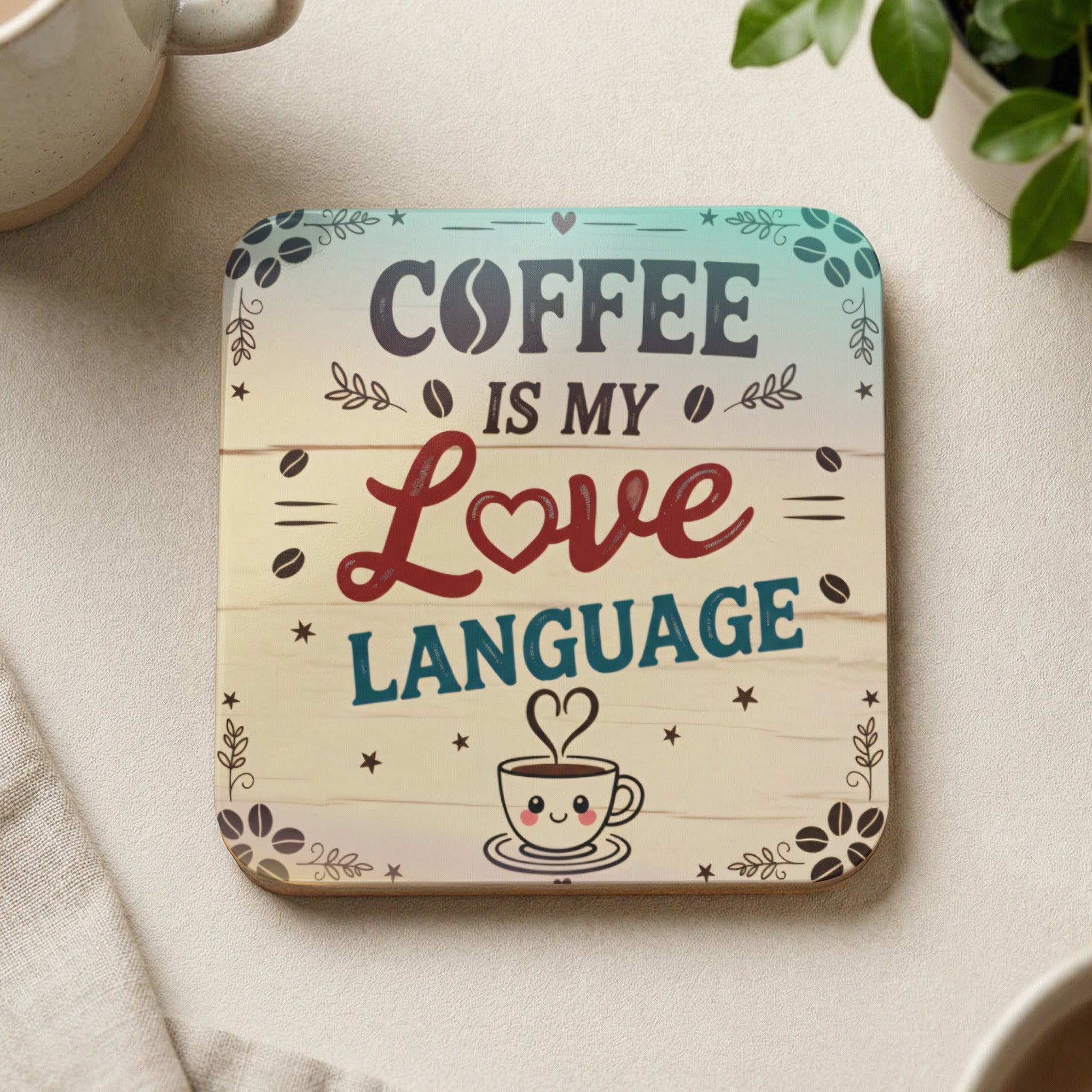 Wooden coaster with "Coffee is my Love Language" text and smiling coffee cup.