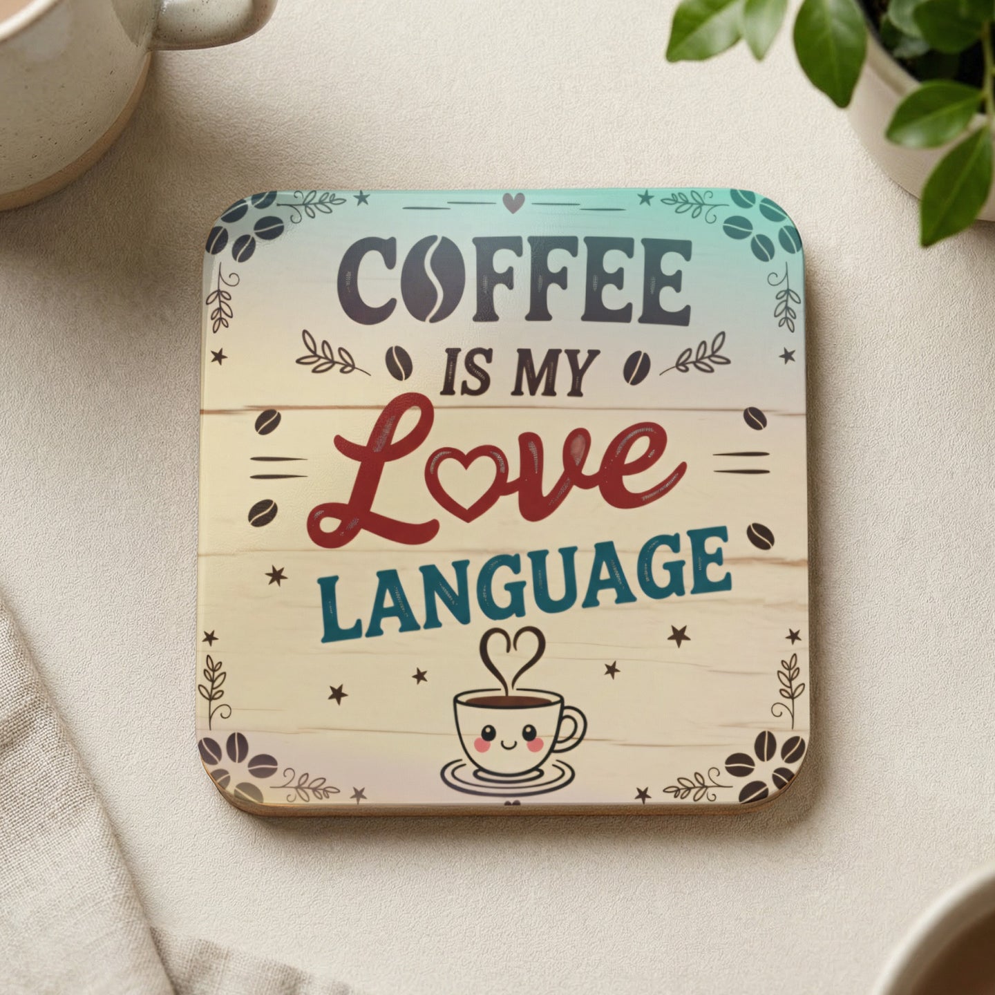Wooden coaster with "Coffee is my Love Language" text and smiling coffee cup.
