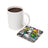 Coaster with woman's portrait and "perfectly imperfect" text next to a white mug.