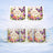 Two coffee mugs with floral and butterfly "Happy Birthday" designs.