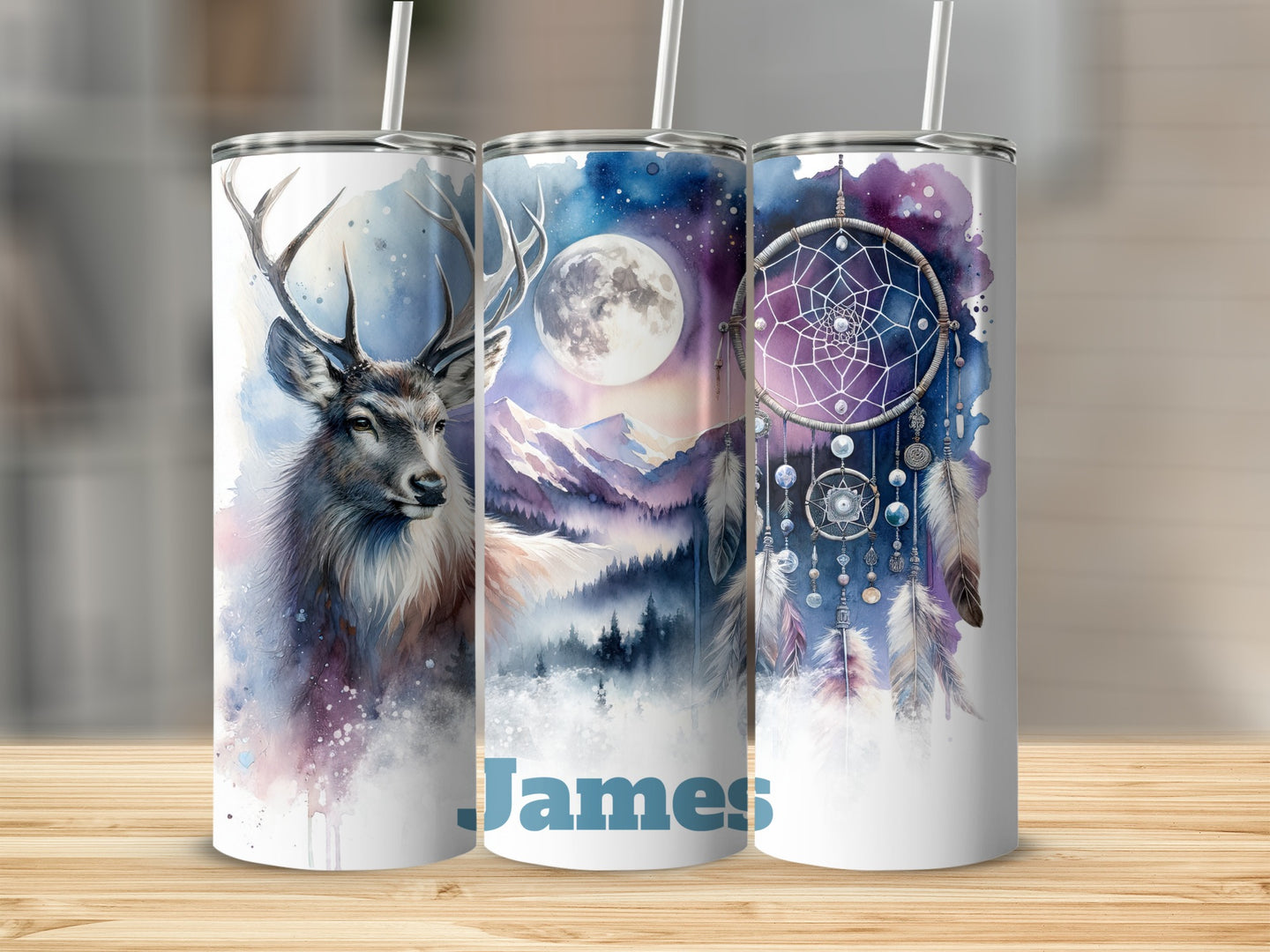 Three tumblers with watercolor deer, mountains, and dreamcatcher designs.