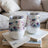 Two white tumblers with watercolor dragonflies and floral designs.